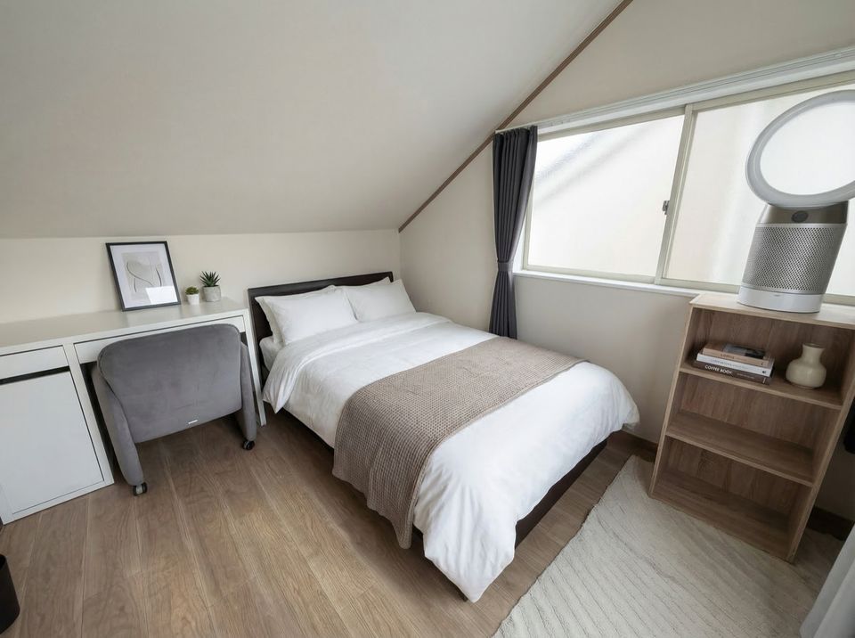 HalfKey furnished bedroom with double bed and air purifier