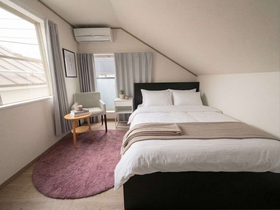 HalfKey furnished bedroom with double bed and reading nook