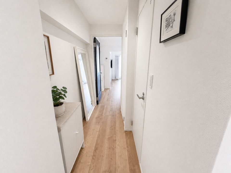 HalfKey apartment hallway with framed art